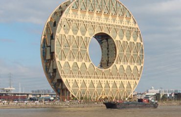 Guangzhou Circle viewed from the opposite side of the river by Midip is licensed under CC BY-SA 3.0